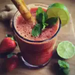 Refreshing strawberry lime mocktail with mint and ginger garnish for summer drinks and recipes for smoothies and cocktails.
