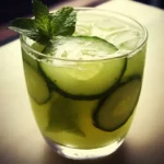 Cucumber mint refreshing drink with ice and fresh herbs, perfect for summer hydration and healthy lifestyle. Great for making homemade soda or mocktail recipes.