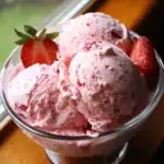 Creamy strawberry ice cream with fresh strawberries, perfect for summer desserts. Delicious homemade strawberry ice cream recipe made with fresh strawberries and cream.