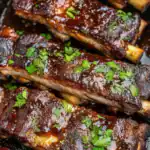 Braised short ribs with rich, smoky barbecue glaze topped with fresh chopped parsley, served hot. Perfect for family dinners or weekend cookouts, these tender beef ribs are full of flavor and easy to prepare.