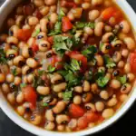 Creamy Black-Eyed Peas Soup with Tomatoes and Fresh Herbs, a hearty and flavorful dish perfect for vegetarian dinners. Packed with protein, vegetables, and herbs, ideal for healthy eating and lunch or dinner.