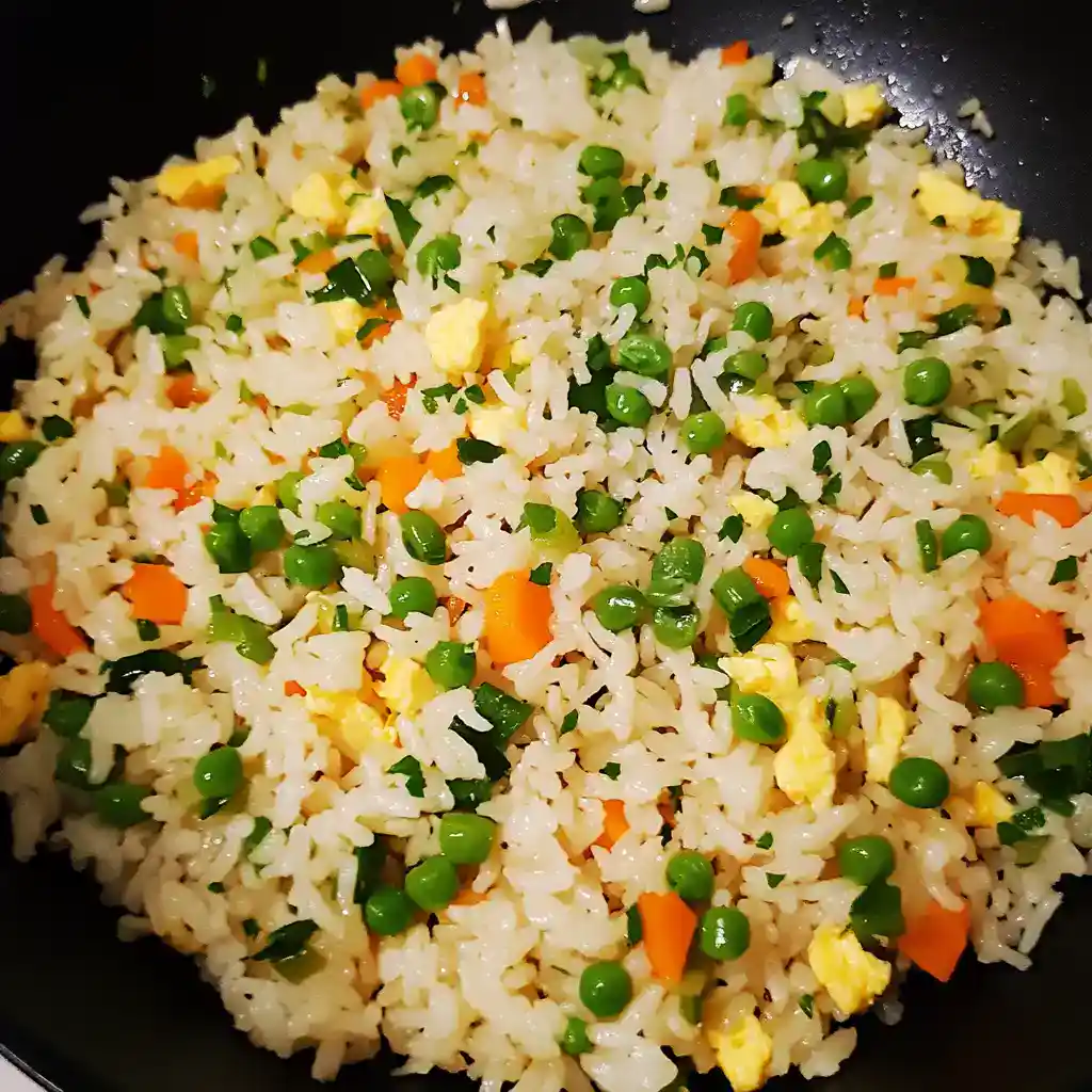 Stir-fried rice with vegetables and scrambled eggs, a quick and easy homemade dish perfect for weeknight dinners and meal prep. Delicious, savory, and nutritious.
