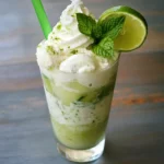 1. Refreshing lime mint smoothie with whipped cream and green straw, perfect for summer drinks and healthy recipes.