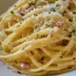Creamy Parmesan Spaghetti Carbonara with crispy bacon, fresh herbs, and a rich cheese sauce perfect for quick dinner recipes.
