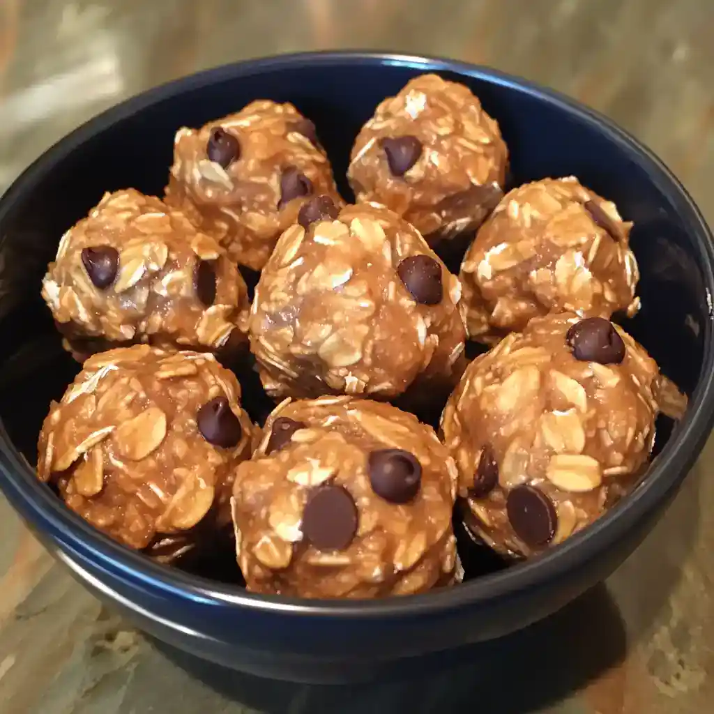 Delicious, healthy fudge protein balls with oats, peanut butter, and chocolate chips, perfect for a nutritious snack or energy boost. Easy to make and great for meal prep.