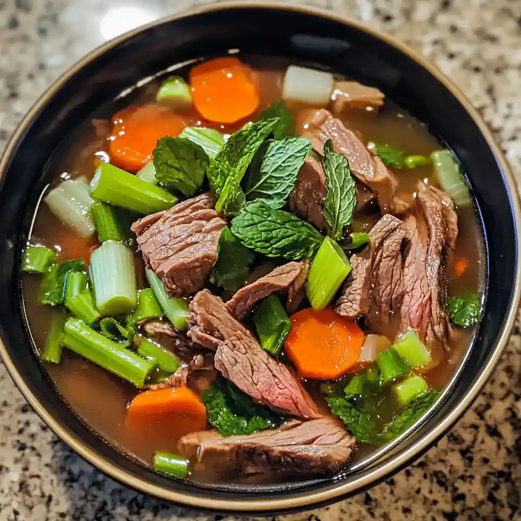Delicious homemade beef vegetable soup packed with tender beef, carrots, celery, and fresh herbs, perfect for cozy meals. Easy recipe to make a nutritious and comforting dish for any occasion.