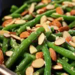 Delicious freshly cooked green beans topped with toasted almonds and garlic, perfect for healthy side dishes or meal prep ideas.