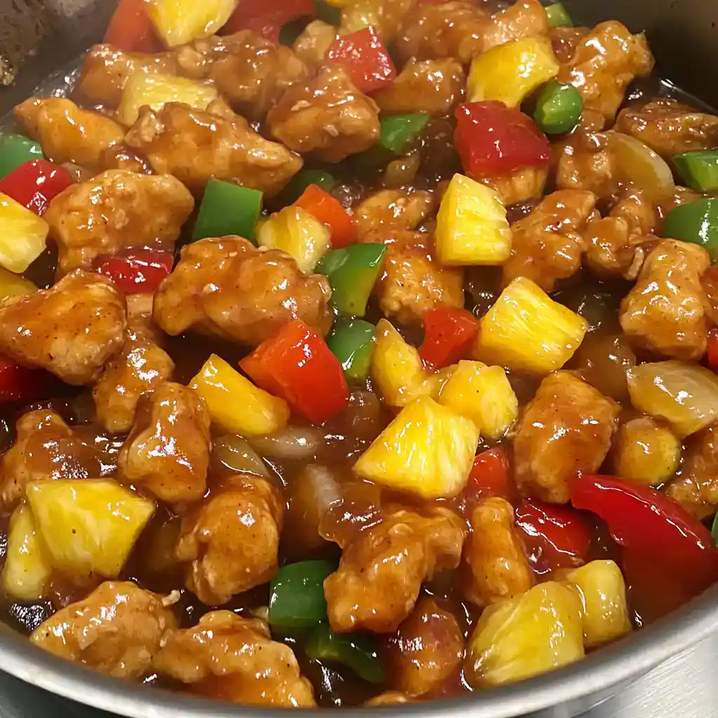 Colorful chicken stir-fry with pineapple, bell peppers, and a tangy sauce, perfect for quick, flavorful meals. Enjoy this easy station recipe for a delicious Asian-inspired dish.