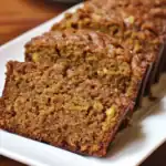 Delicious homemade carrot loaf with walnuts and cinnamon, perfect for breakfast or snack. Easy baking recipe with wholesome ingredients.