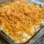 Delicious cheesy corn casserole with a crispy topping, perfect for family dinners and holiday gatherings. Easy to prepare with fresh corn, cheese, and crunchy breadcrumbs.