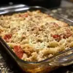 A delicious baked pasta casserole featuring pasta, tomatoes, and herbs, topped with melted cheese. Perfect comfort food for family dinners and gatherings.